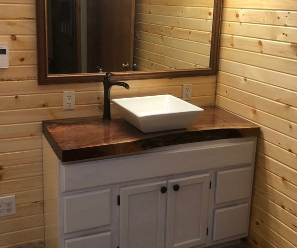 A wooden epoxy bathroom countertop.