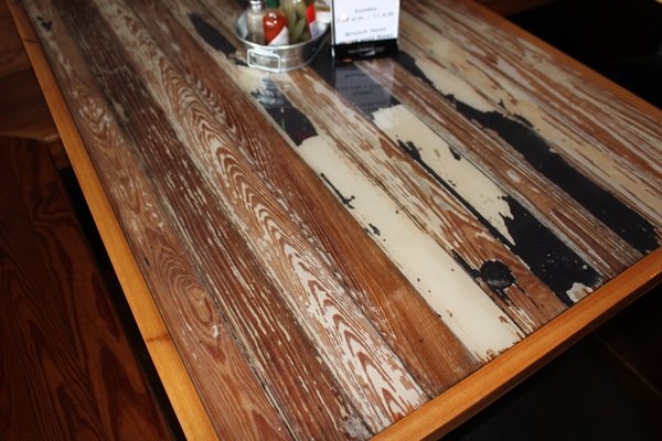 A wooden epoxy table top in a commercial establishment.
