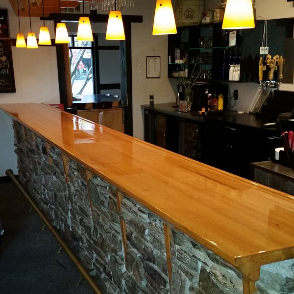 A large wooden epoxy bar top.