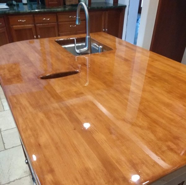 A light-toned wooden epoxy countertop.