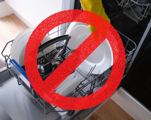 A photo of a dishwasher being loaded, with a symbol of a red warning sign overlaid.