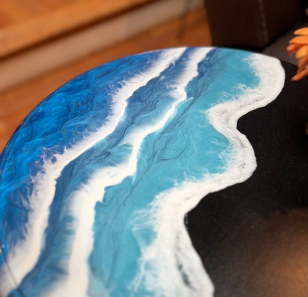 An epoxy table top with a colorful ocean-themed finish.