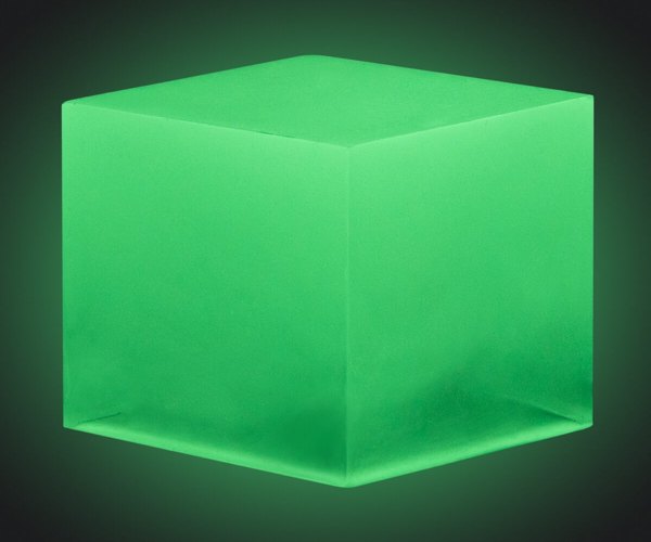 An epoxy cube made using Yellow-Green Glow in the Dark pigment from Pigmently.