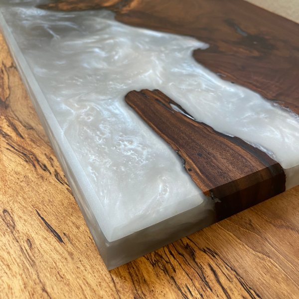 A finely sanded wooden epoxy tray, tinted white with Pigmently Pigments.