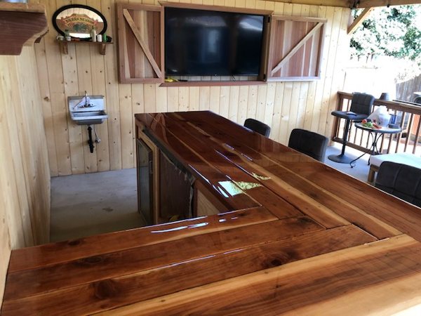 A beautiful outdoor domestic wooden epoxy bar top.