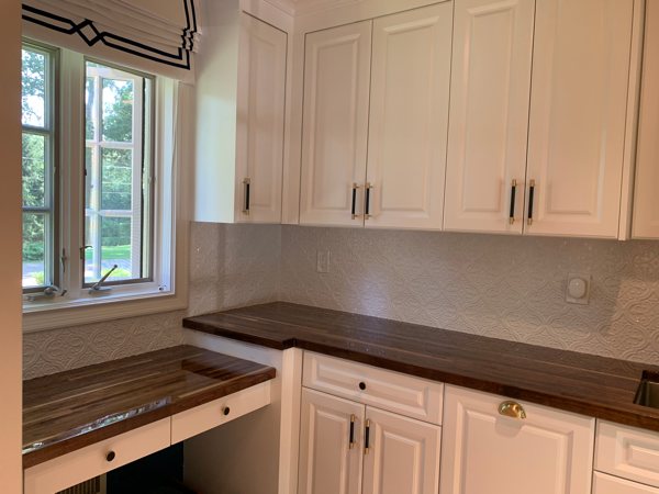 A wooden epoxy corner countertop.