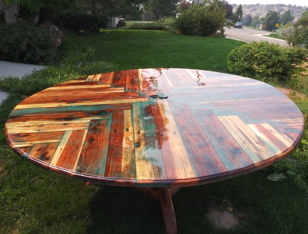 A colorful outdoor wooden epoxy resin table top.