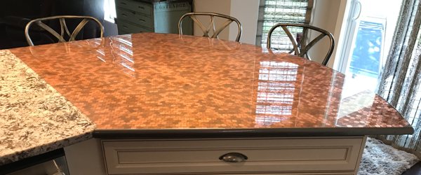 A penny epoxy countertop made by carefully measuring the epoxy resin before pouring.