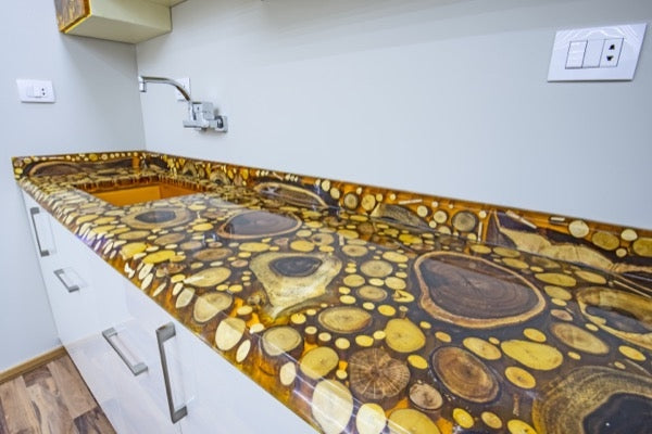 An epoxy countertop tinted with a yellow-orange mica powder pigment.