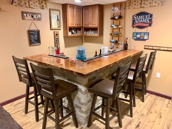 A wooden epoxy bar top in a domestic environment.