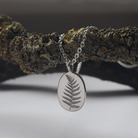 silver pendant with fern engraved motif by erin claus