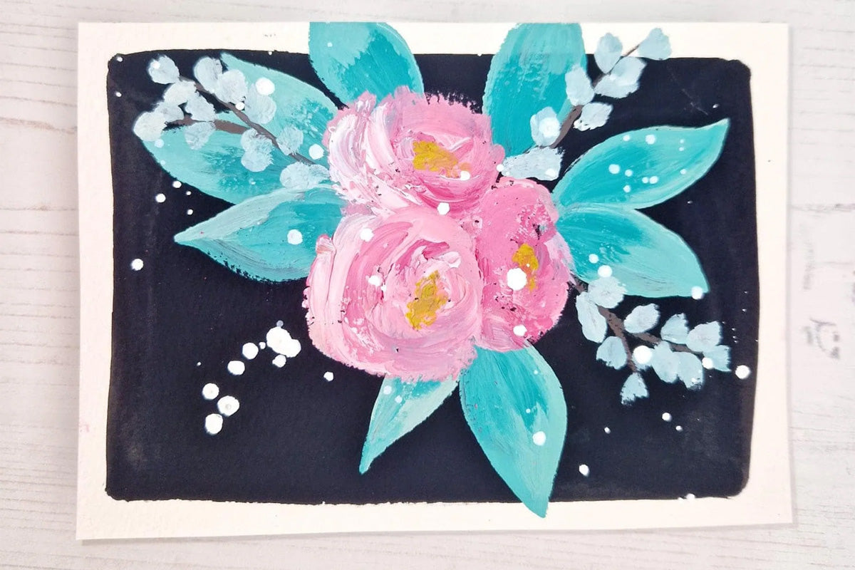 A card  with  three pink flowers arranged in a bouquet as the focal point, created with Artistry by Altenew's gouache paint set