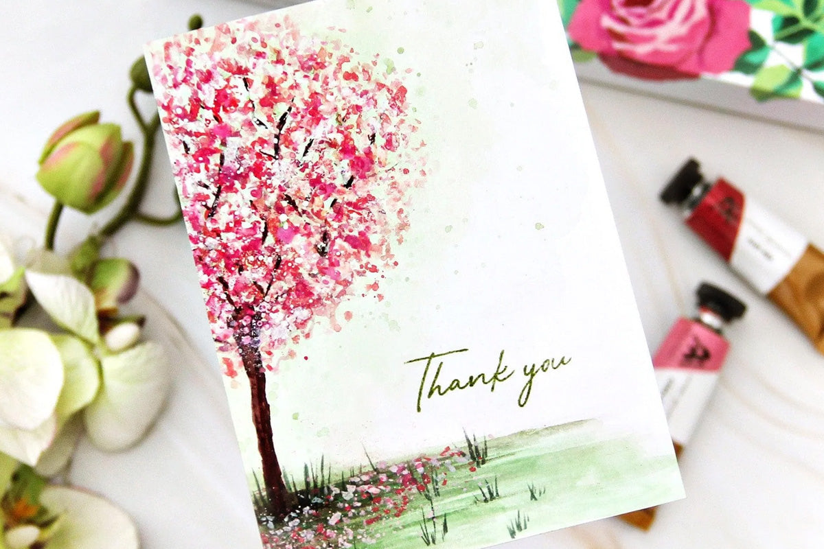 A thank-you card with the painting of a cherry blossom tree, created with Artistry by Altenew's gouache paint set