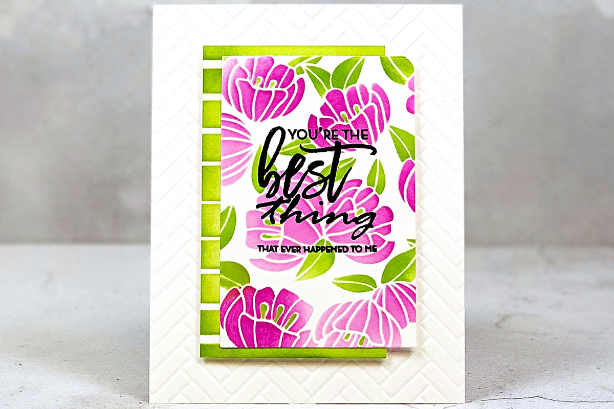 An appreciation card with purple flowers and green stripes in the background