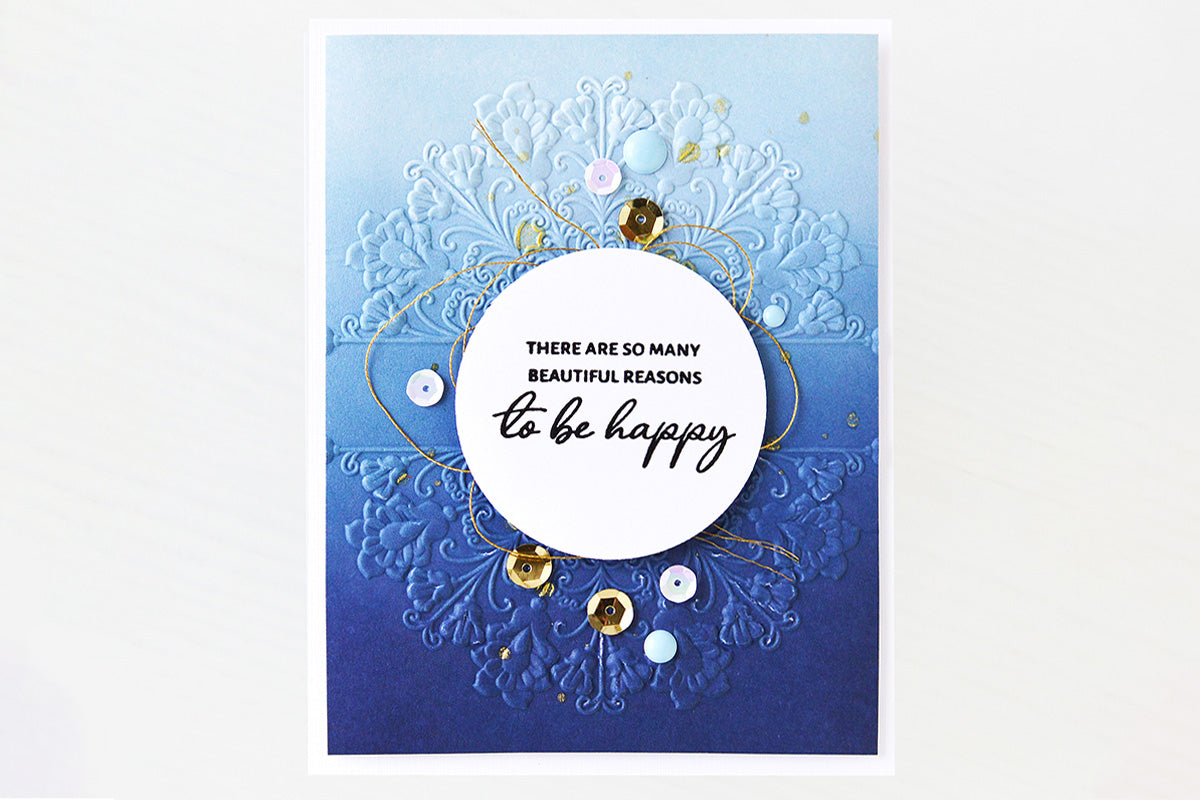 A textured card with a colorful mandala design for the background and the word "breathe" as the focal point