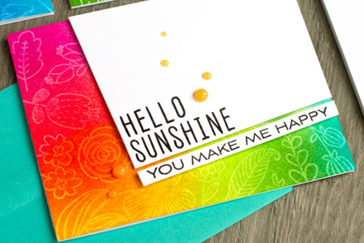 A rainbow ombre background greeting card made by Jennifer McGuire with ink blending brushes