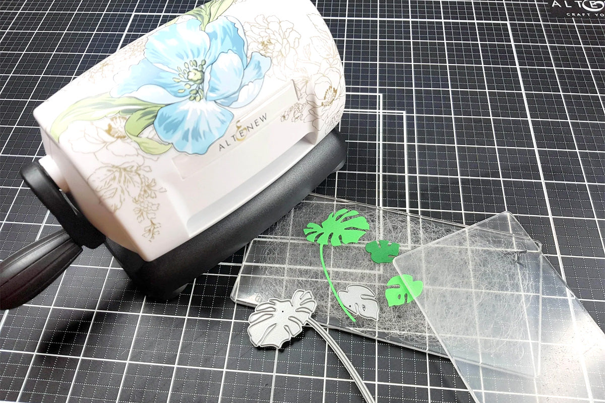 A Blue Flower Decal on an Altenew Mini-Blossom Die Cutting Machine