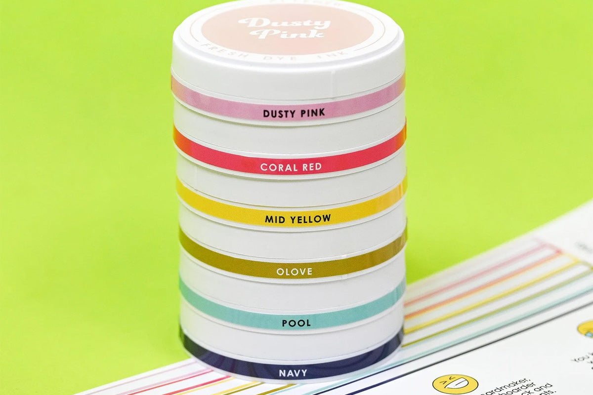 Fresh Dye Ink pads of the Deco Garden color Family from Altenew, stacked on top of each other with side-labels
