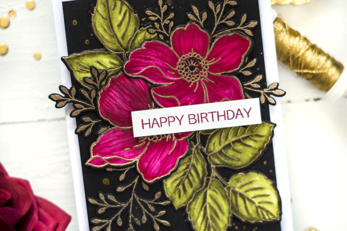 Handmade birthday card with bold colors and heat-embossed flowers
