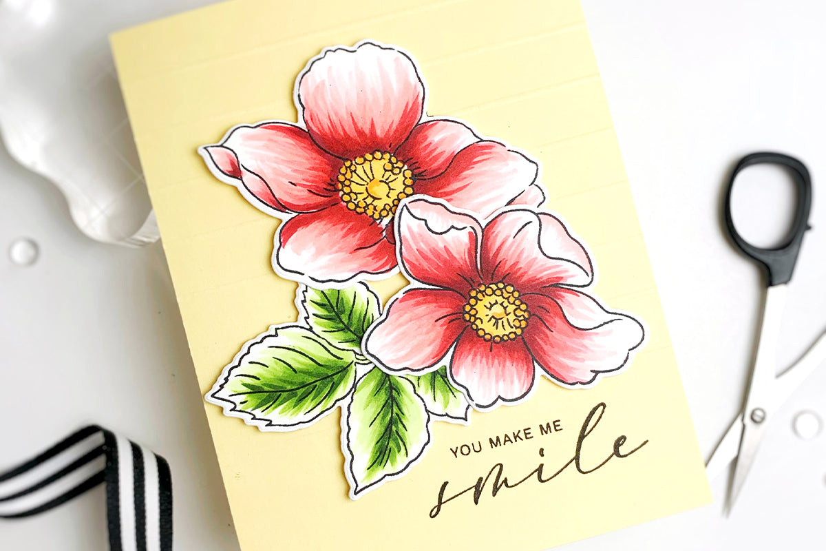 Clean and simple handmade card with red Japanese anemones and a yellow background