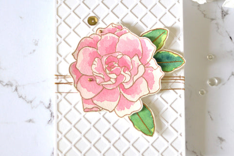 Simple floral handmade card with a white background and pink flowers
