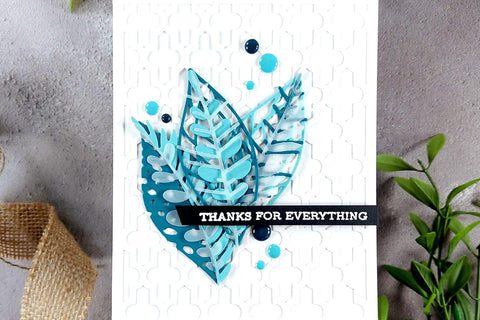 Monochromatic thank you card with color coordinated leaf die-cuts and enamel dots