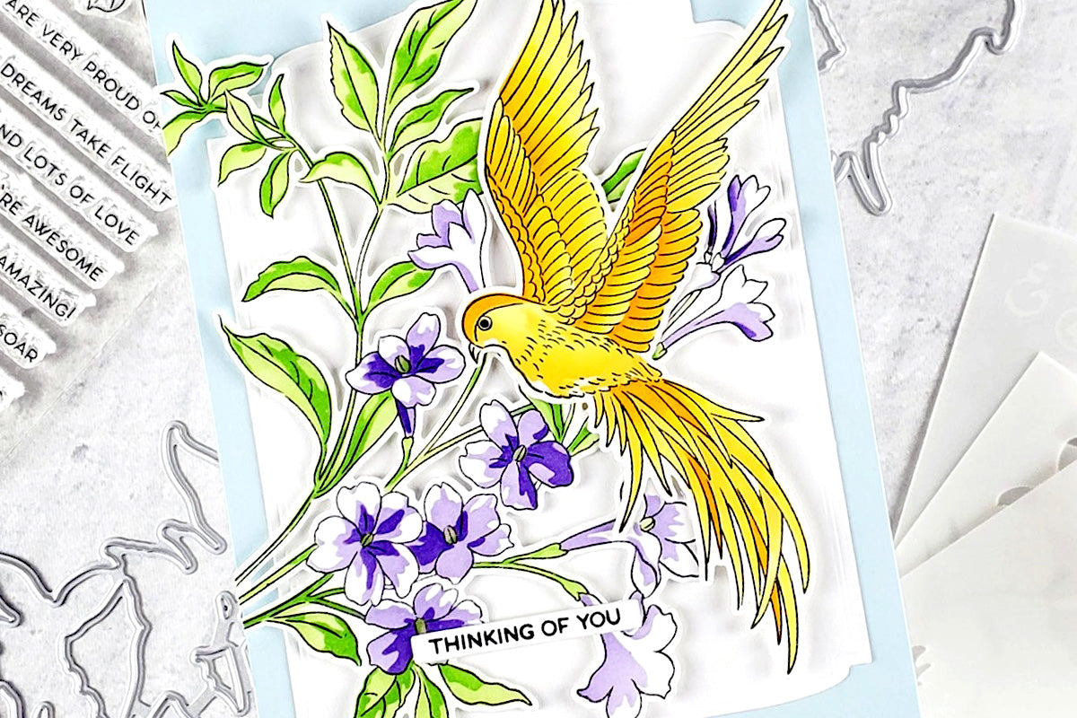 Clean and simple "thinking of you" card with purple tuberoses and a yellow bird on a white and blue background