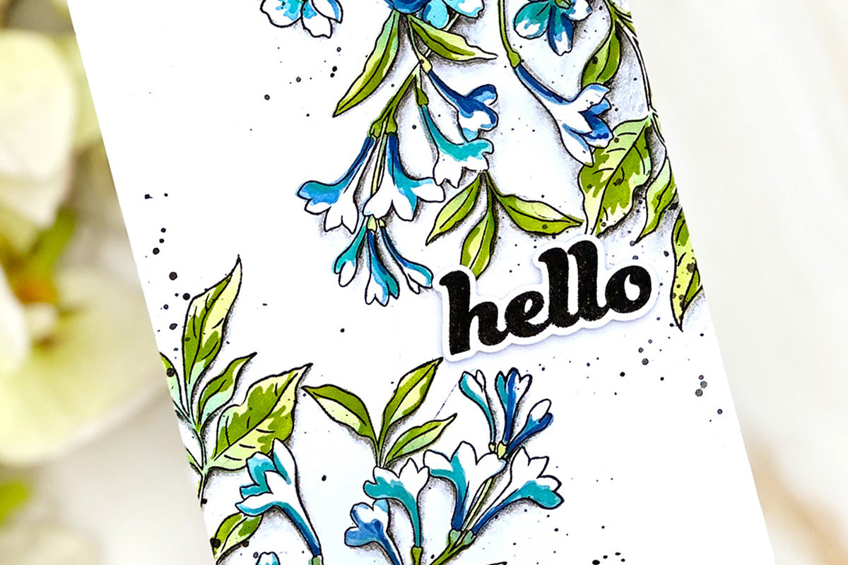Clean and simple handmade card idea with blue tuberoses and a die-cut sentiment "hello"
