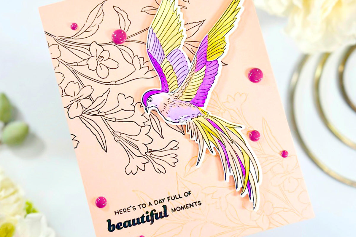 Easy handmade greeting card with stamped floral images and a colorful bird die-cut, decorated with pink enamel dots