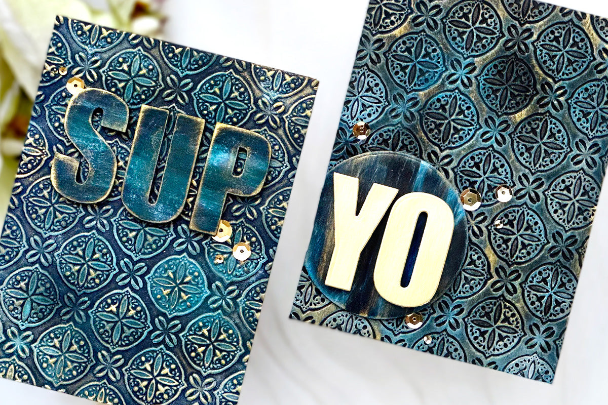2 handmade greeting cards with 3D embossed teal and tarnished gold background and the greetings "sup" and "yo"