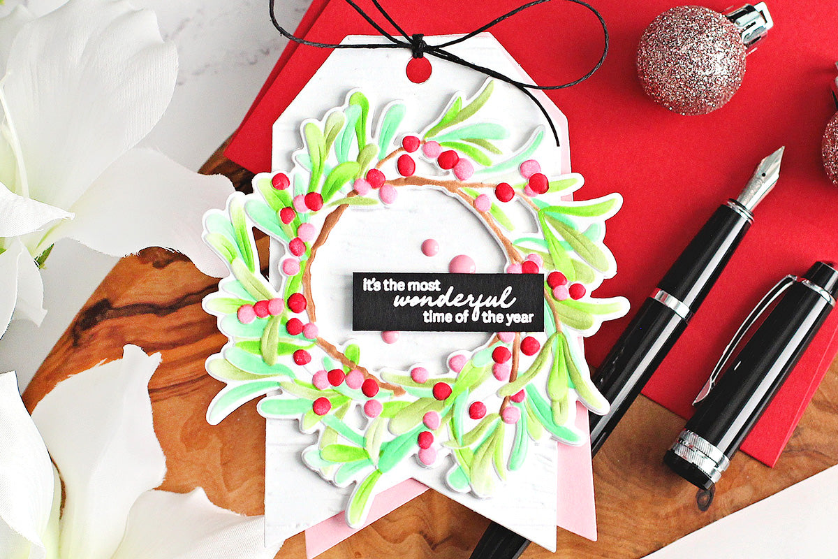 DIY Christmas tag with a 3D embossed holiday wreath