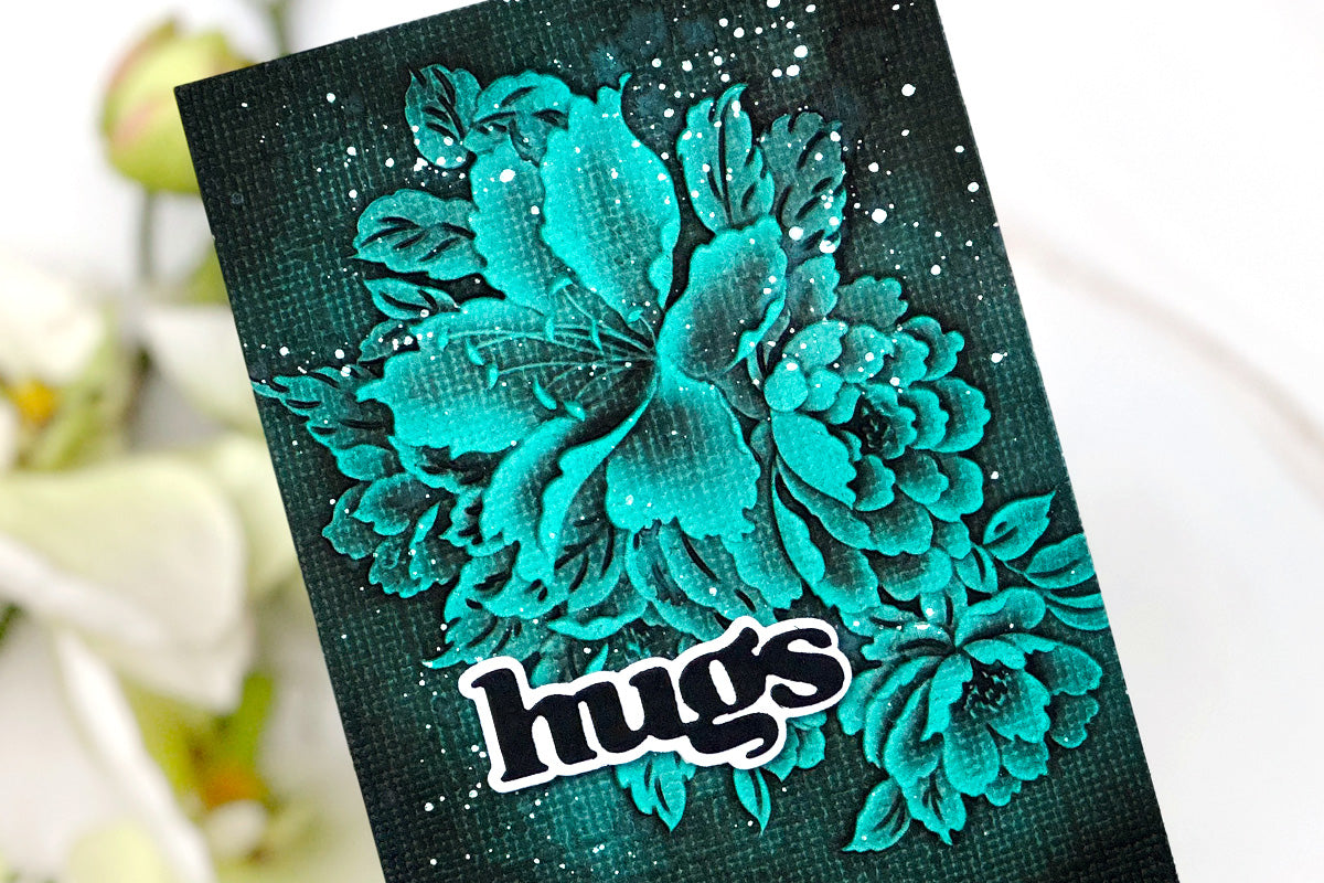 Beautiful 3D embossed teal handmade greeting card with 3D flower arrangement and the sentiment "hugs"