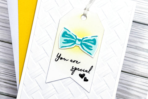 Clean and simple Father's Day card with 3D embossed white background and a bow tie image