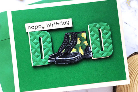 Easy DIY birthday card idea for dads with a green background and the word die-cut "dad" with the "a" replaced by a pair of military boots