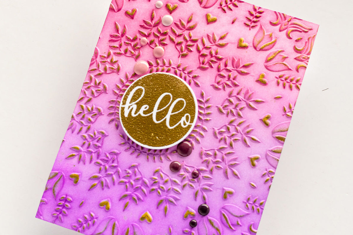 3D embossed floral wreath design on a handmade card