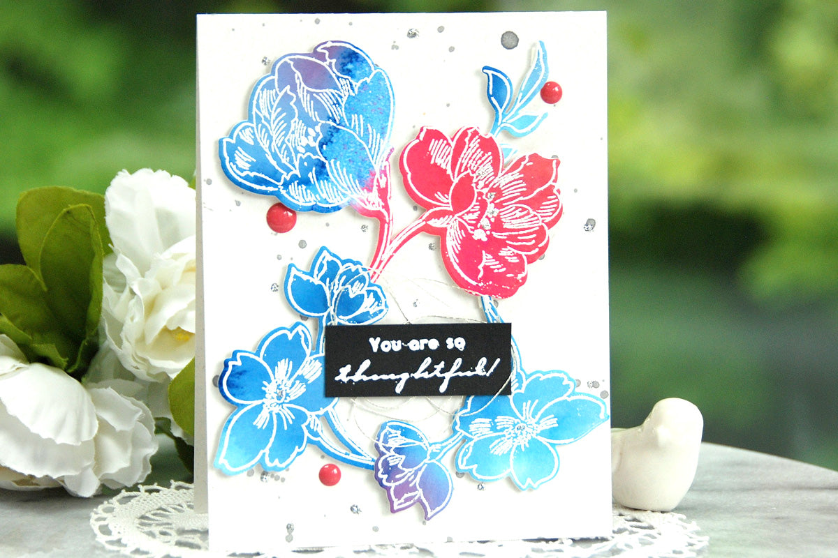 A colorful, embossed card featuring lovely flowers 