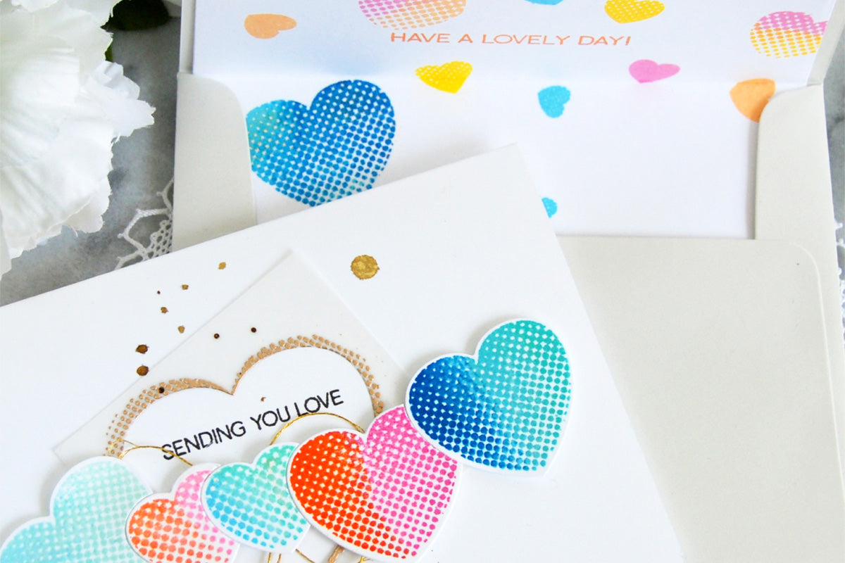 Valentine's Day card with halftone hearts and a decorated greeting card envelope