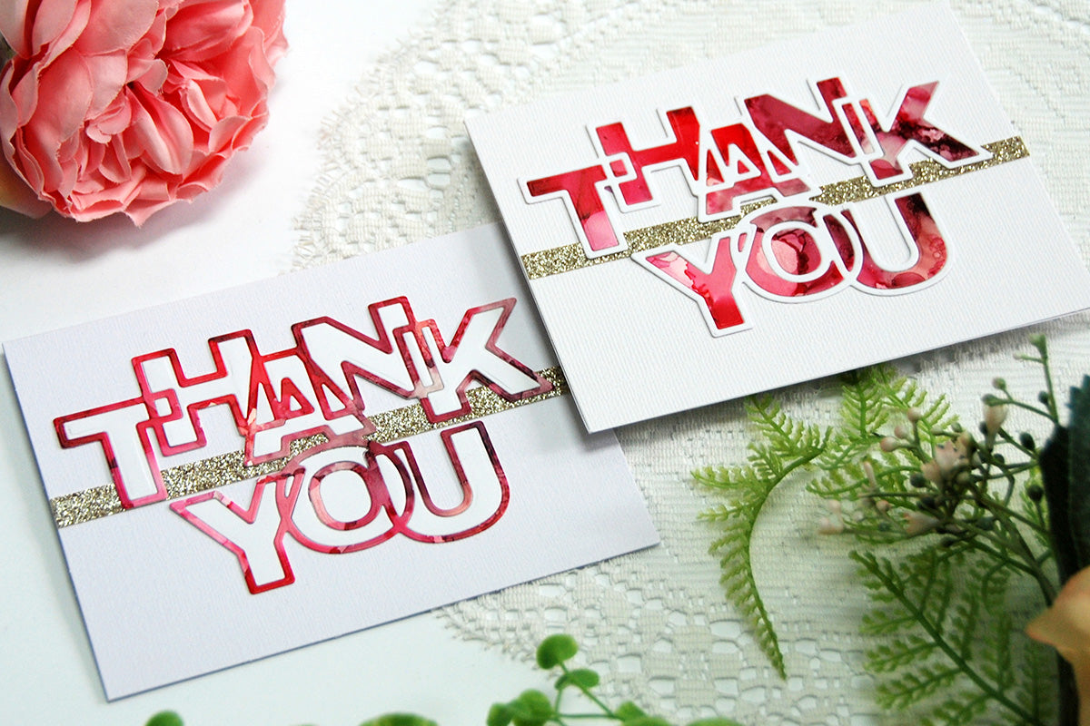 2 thank you cards with die-cut word "thank you" colored using alcohol ink techniques