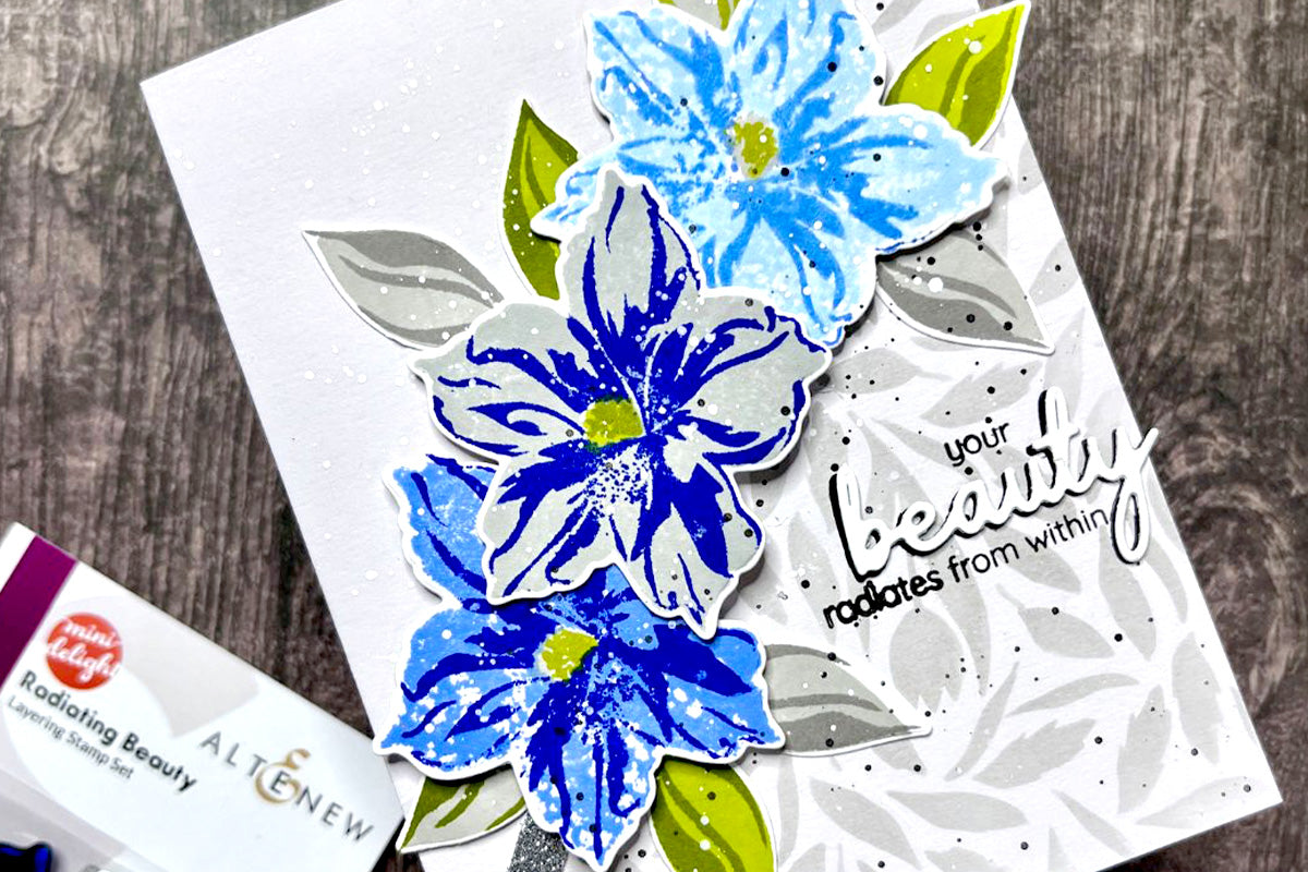 Encouraging handmade card with blue floral die-cuts and stenciled leafy background