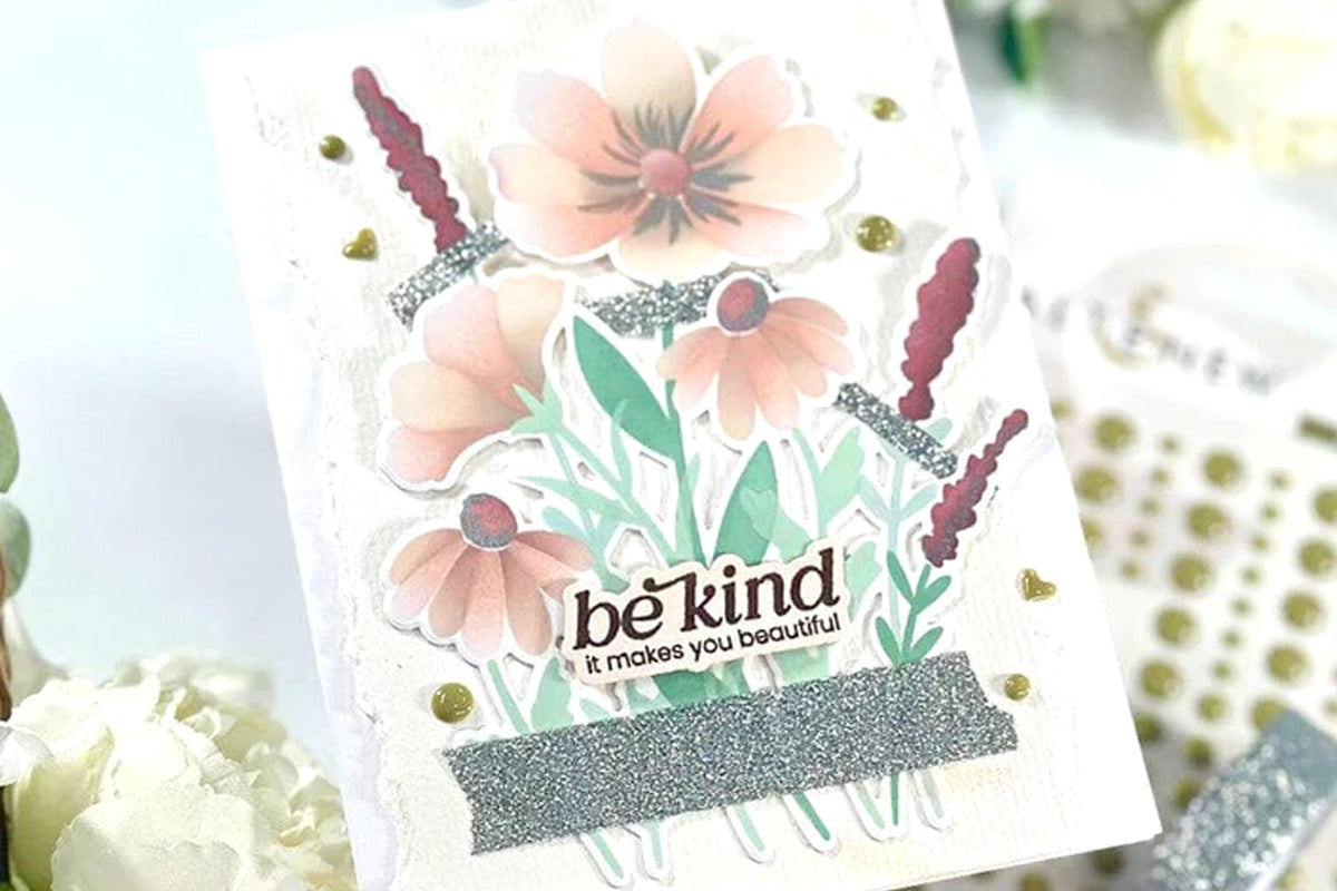 A "Be kind" card with floral blooms as focal points, embellished with Mossy Granite Enamel Dots and Moonlit Silver Glitter Tape
