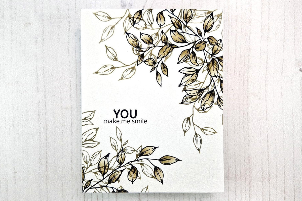 A "You make me smile" card decorated with the Rustling Leaves stamp set and colored in with the Mossy Granite Fresh Dye Ink Cube