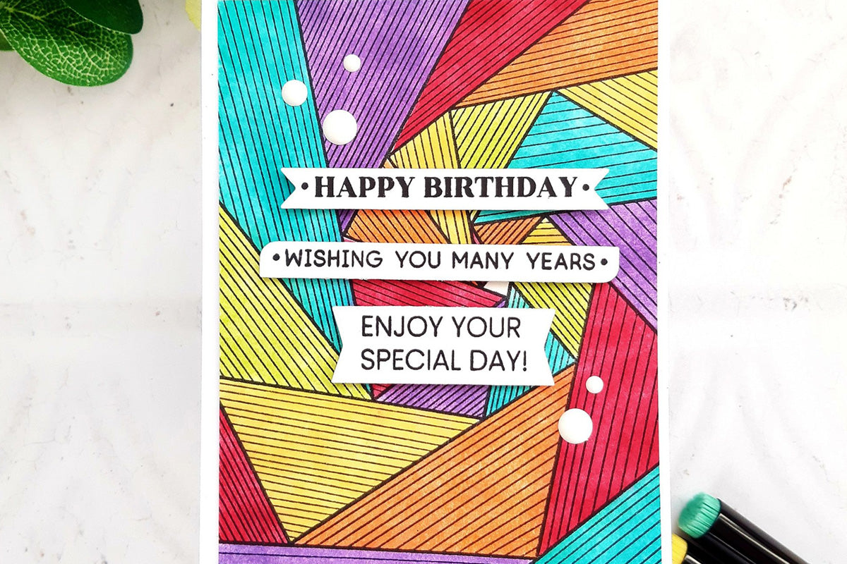 Birthday sentiment strips on a colorful, geometric handmade birthday card