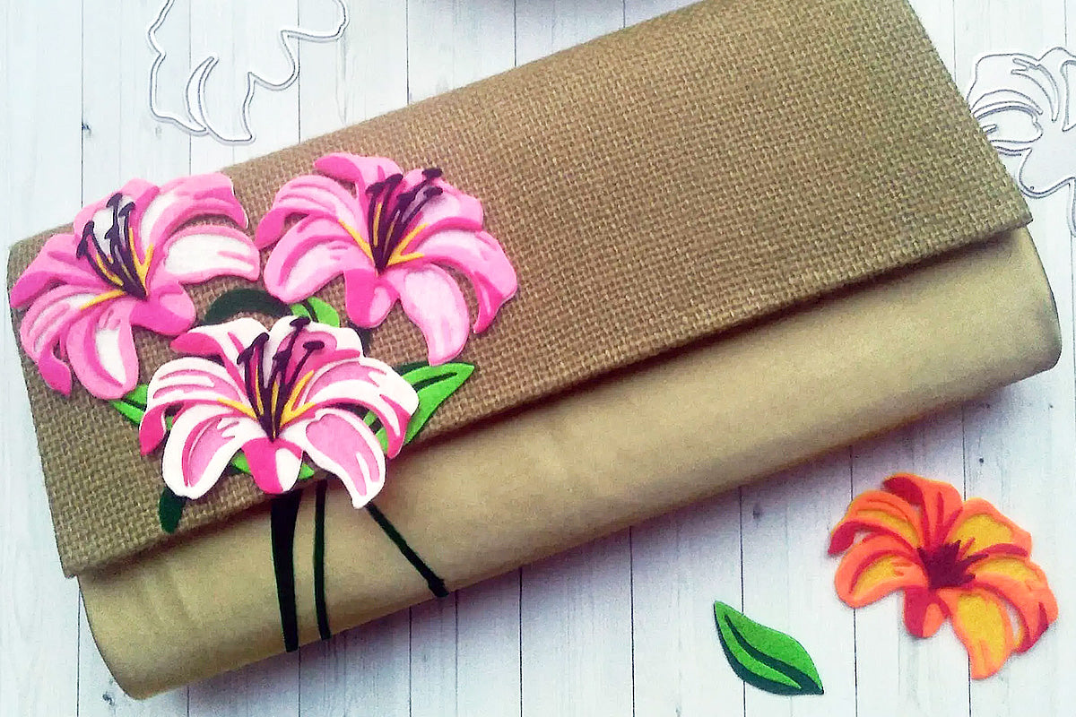 A brown clutch customized with 3D flowers cut from artificial felt