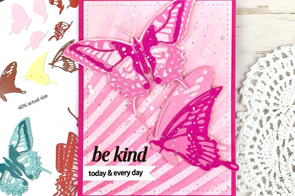 A pink-butterfly motif card with the sentiment "Be Kind", created by die cutting colored cardstock