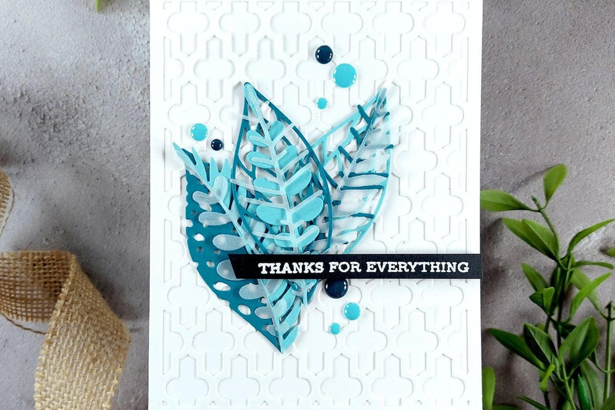 A thank-you card  created with a leaf-designed dies and a patterned cover die for the background