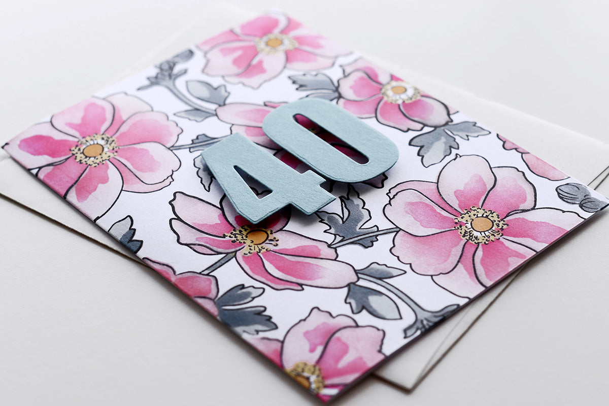 Easy handmade birthday card with the number "40" and stenciled flowers on the card front