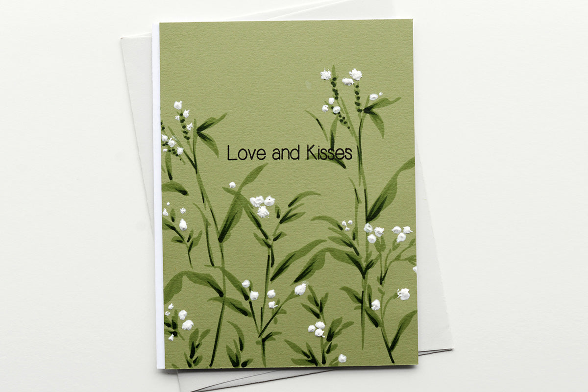 Simple gender-neutral anniversary card with stamped white flowers and leaves