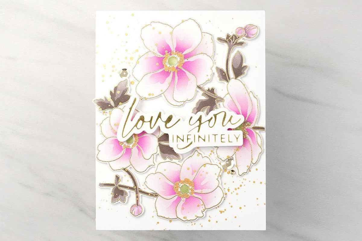 Floral anniversary card with a wreath of pink flowers and gold foiled sentiments