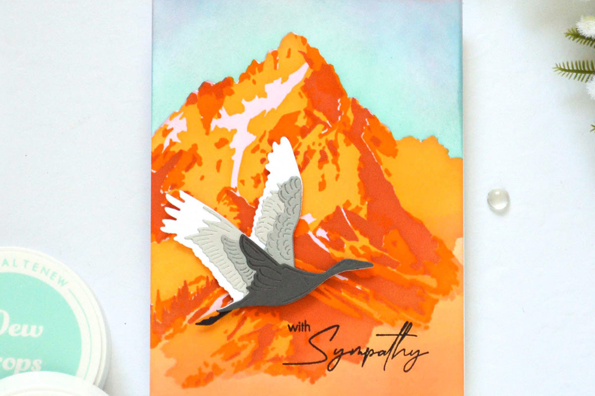 Beautiful nature-themed sympathy card with an image of a mountain and a bird flying across it