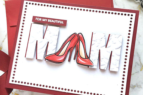 A Mother's Day greeting card with the word "MOM" on massive die-cut letters and the 'O' replaced with a pair of stilettos